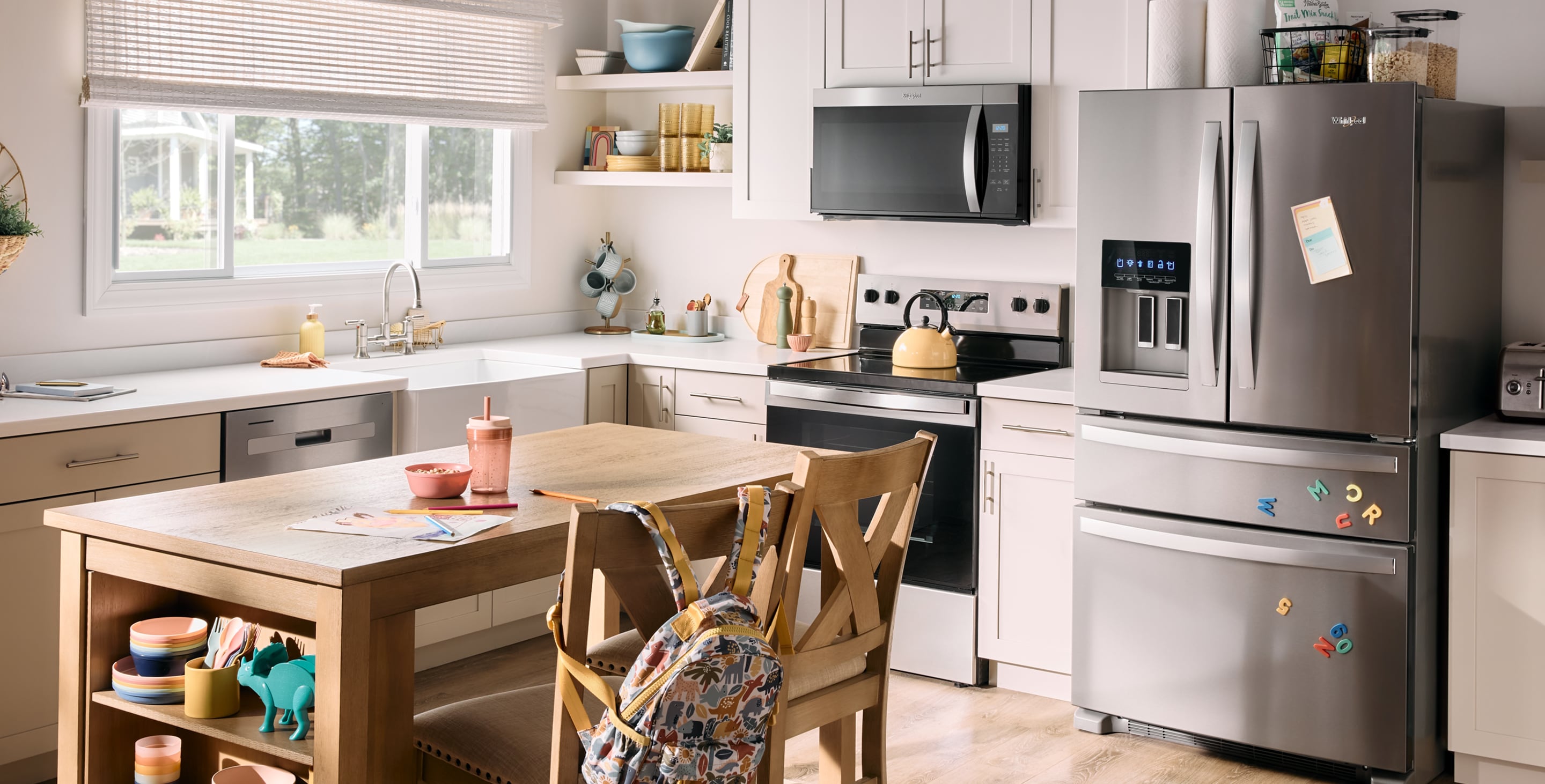A bright, sunny kitchen with a full suite of Whirlpool® Appliances