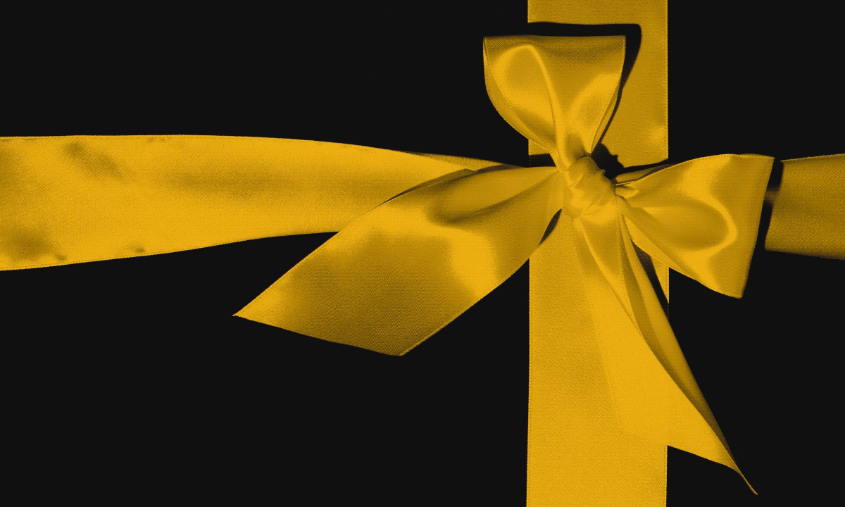 Untying a bow revealing a kitchen
