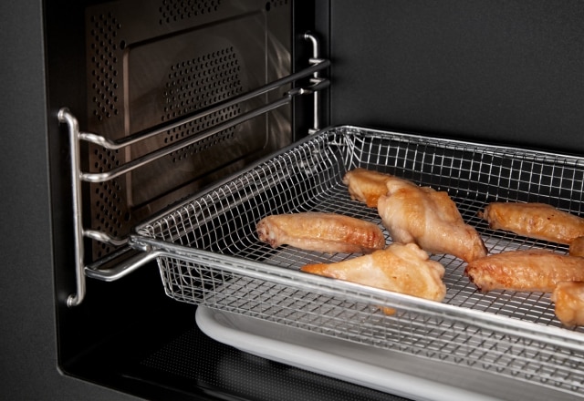 Air fryer basket with chicken wings