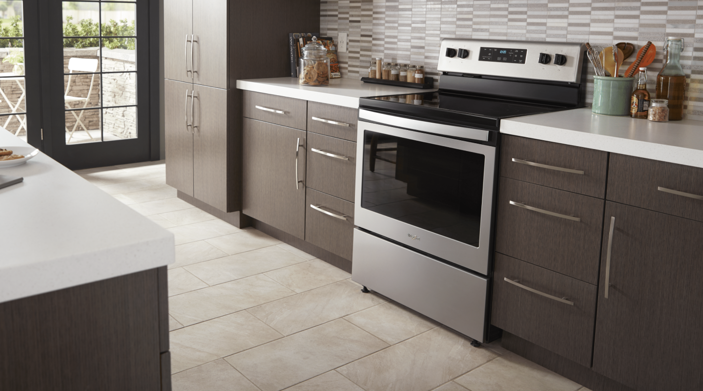 A Whirlpool® oven in a modern kitchen. A Whirlpool® oven in a modern kitchen.