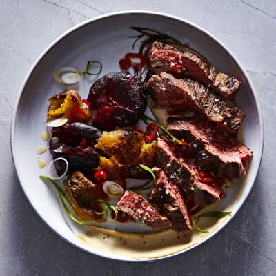 Steak and vegetables in a shallow bowl