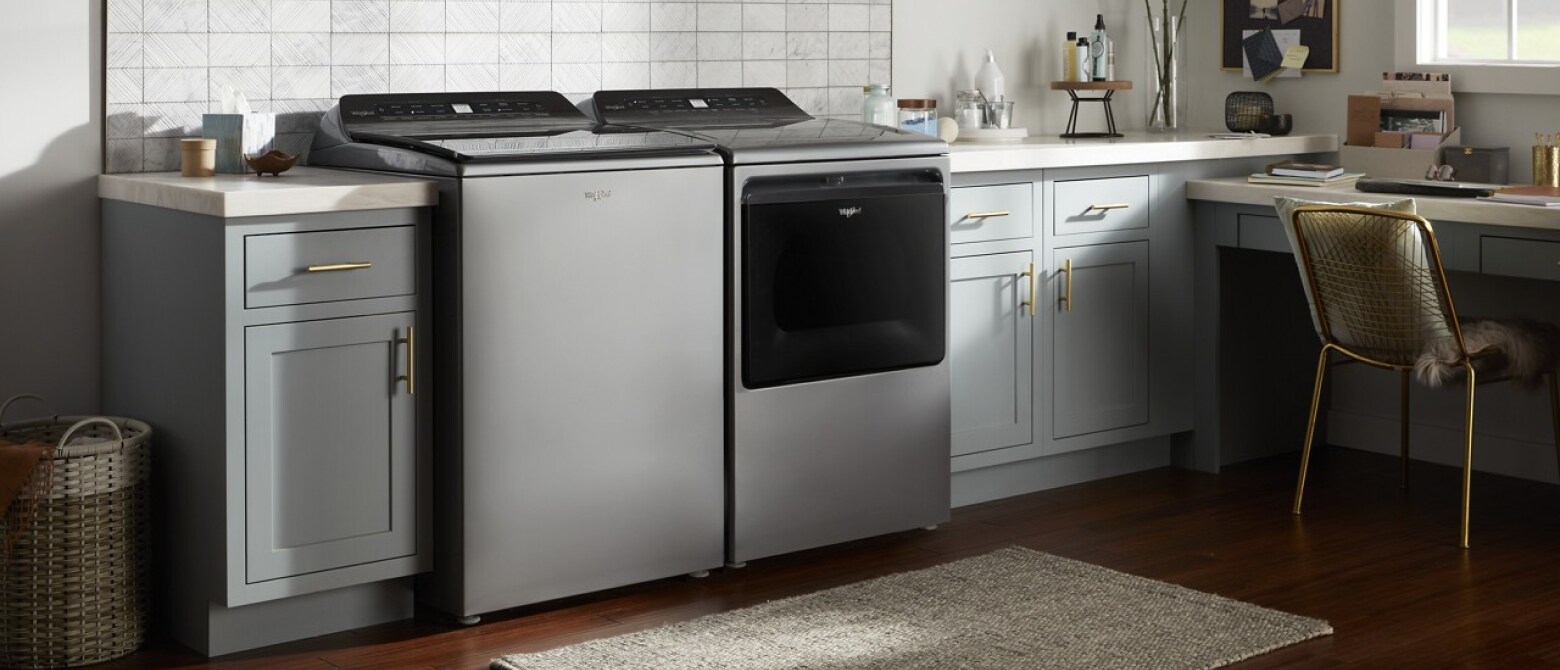 A washer and dryer pair in a laundry room.