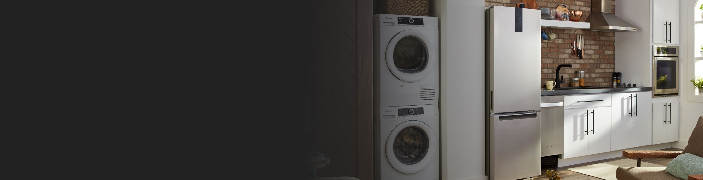 Small kitchen with compact appliances, including a washer and dryer