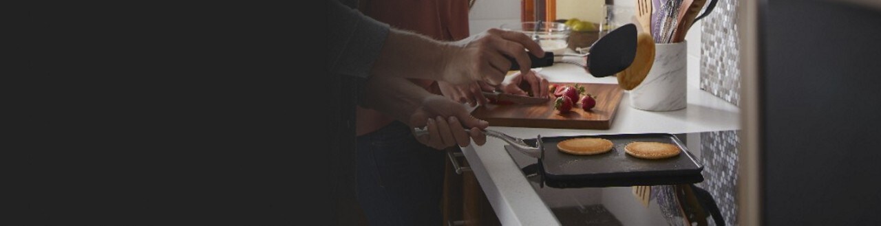 Pancakes being flipped over an induction cooktop