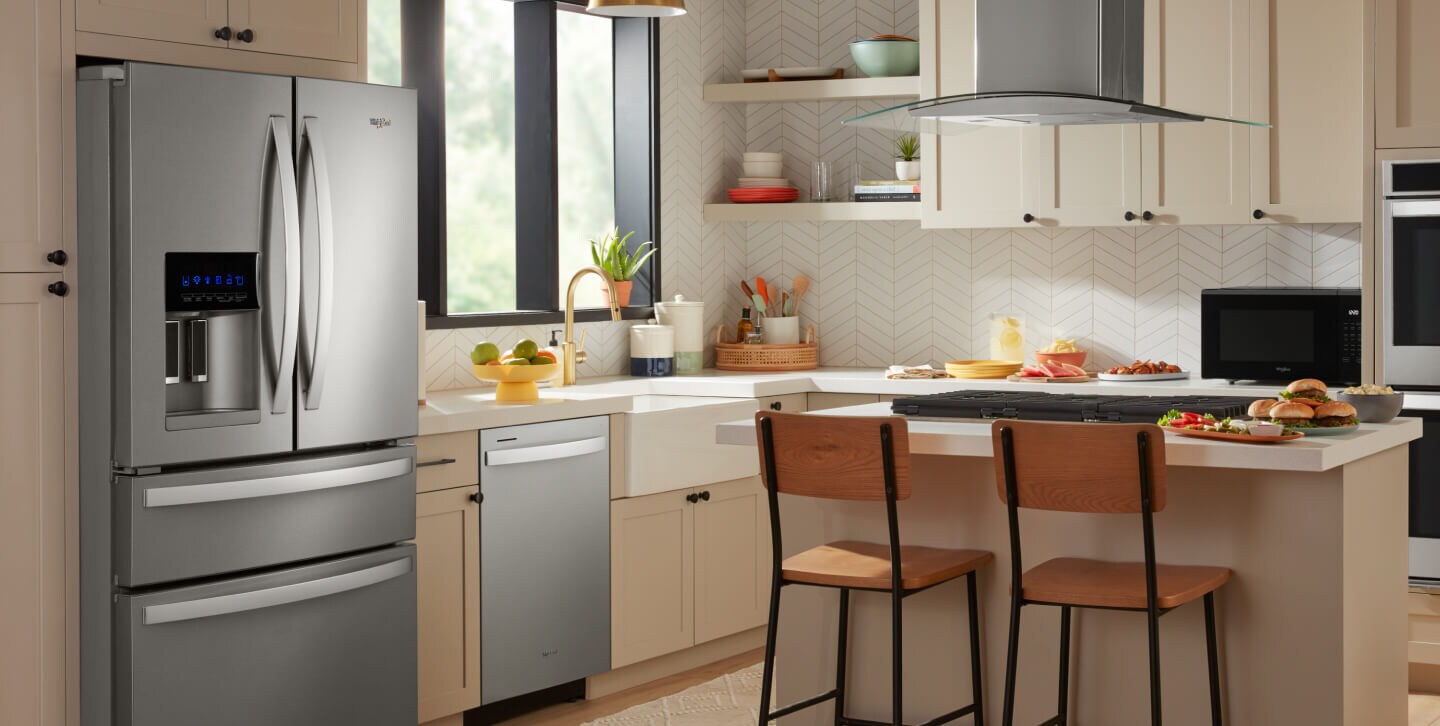 Kitchen with light cabinetry featuring Whirlpool® Appliances