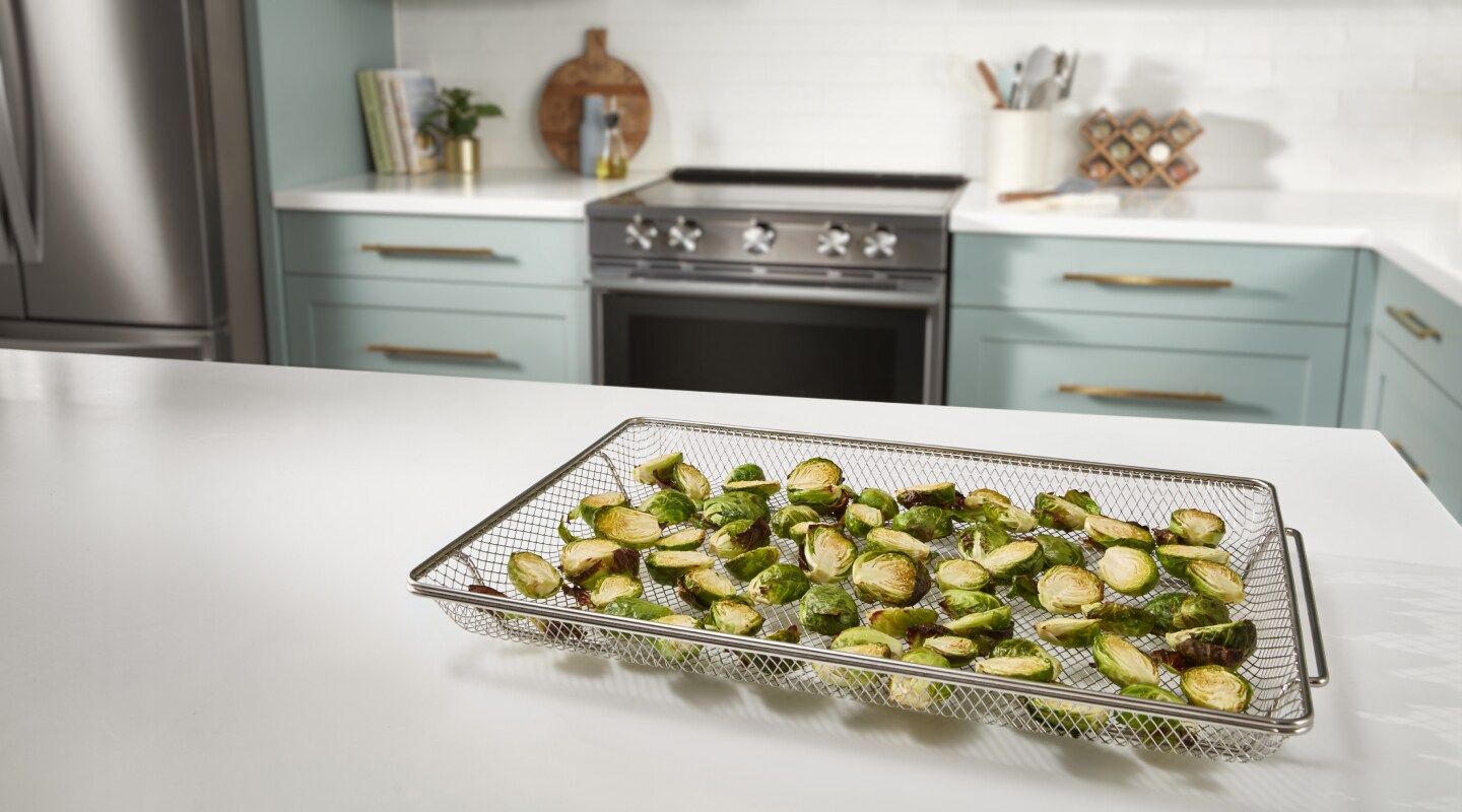 Brussels sprouts in an air fry basket Brussels sprouts in an air fry basket