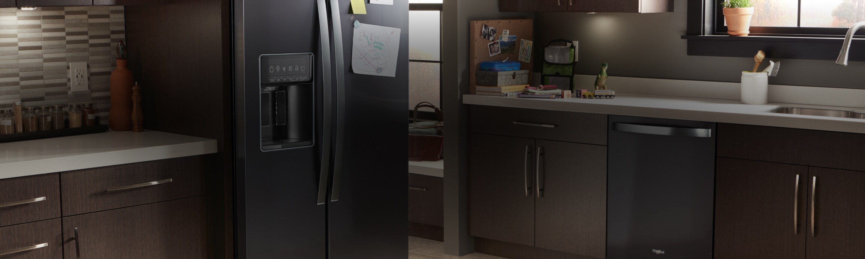 A Whirlpool® kitchen appliance suite featuring the low-profile microwave hood combination.