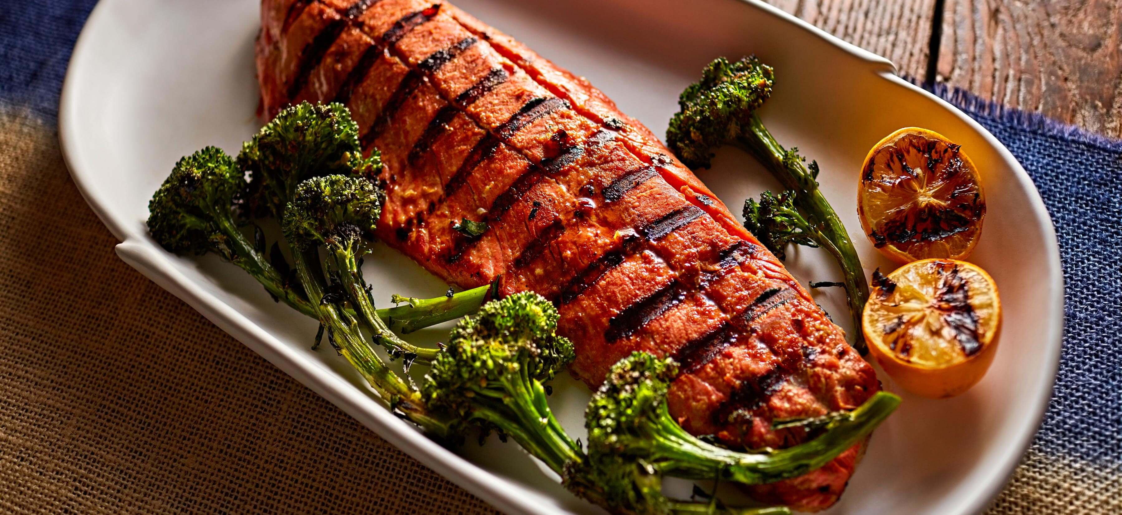Two glazed miso-ginger salmon fillets with crispy broccolini fresh from a Whirlpool®  air fryer