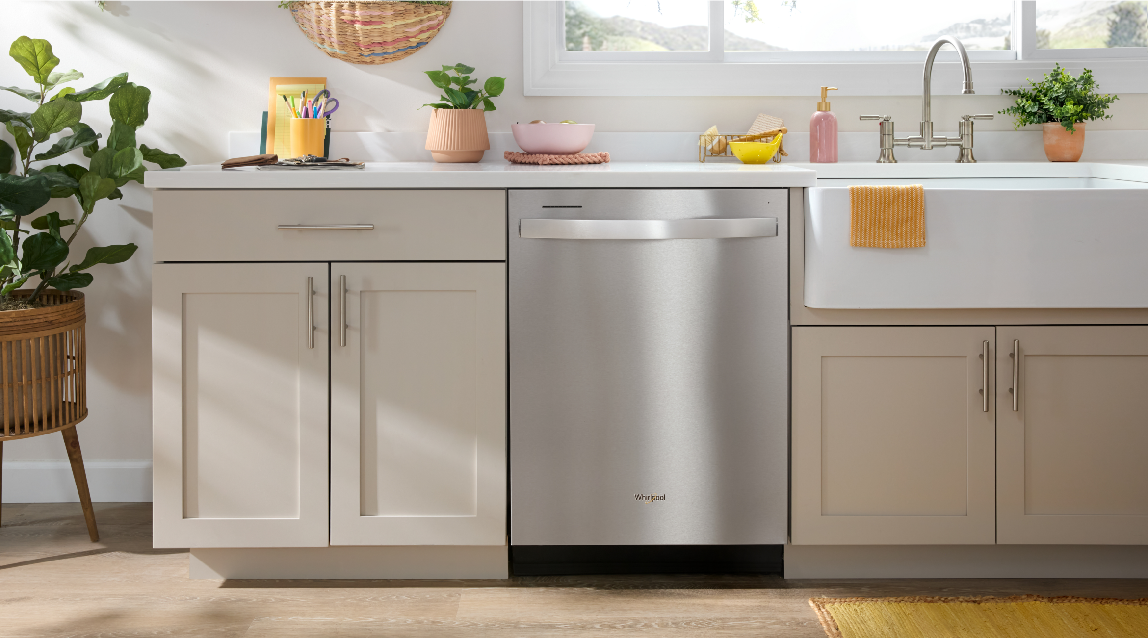 A Whirlpool® Standard Dishwasher in a kitchen with white cabinets