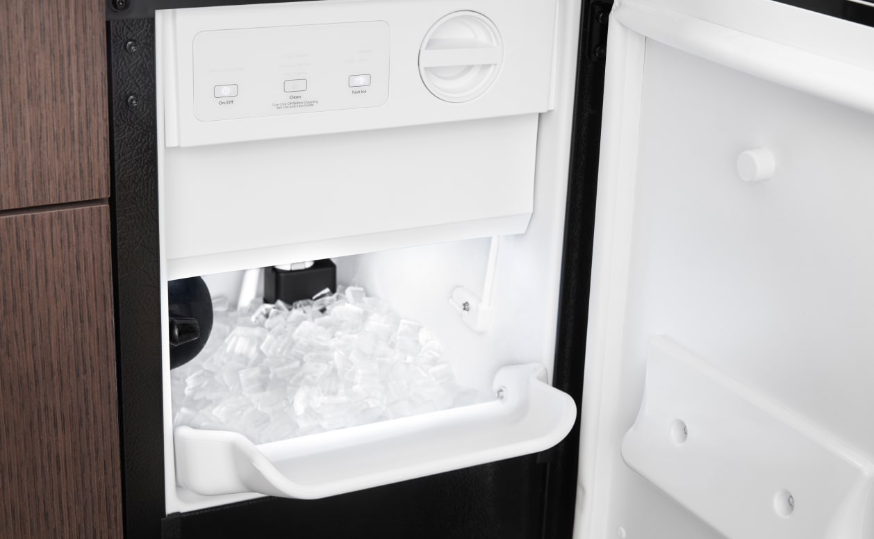 Whirlpool® Ice Maker open to show ice inside