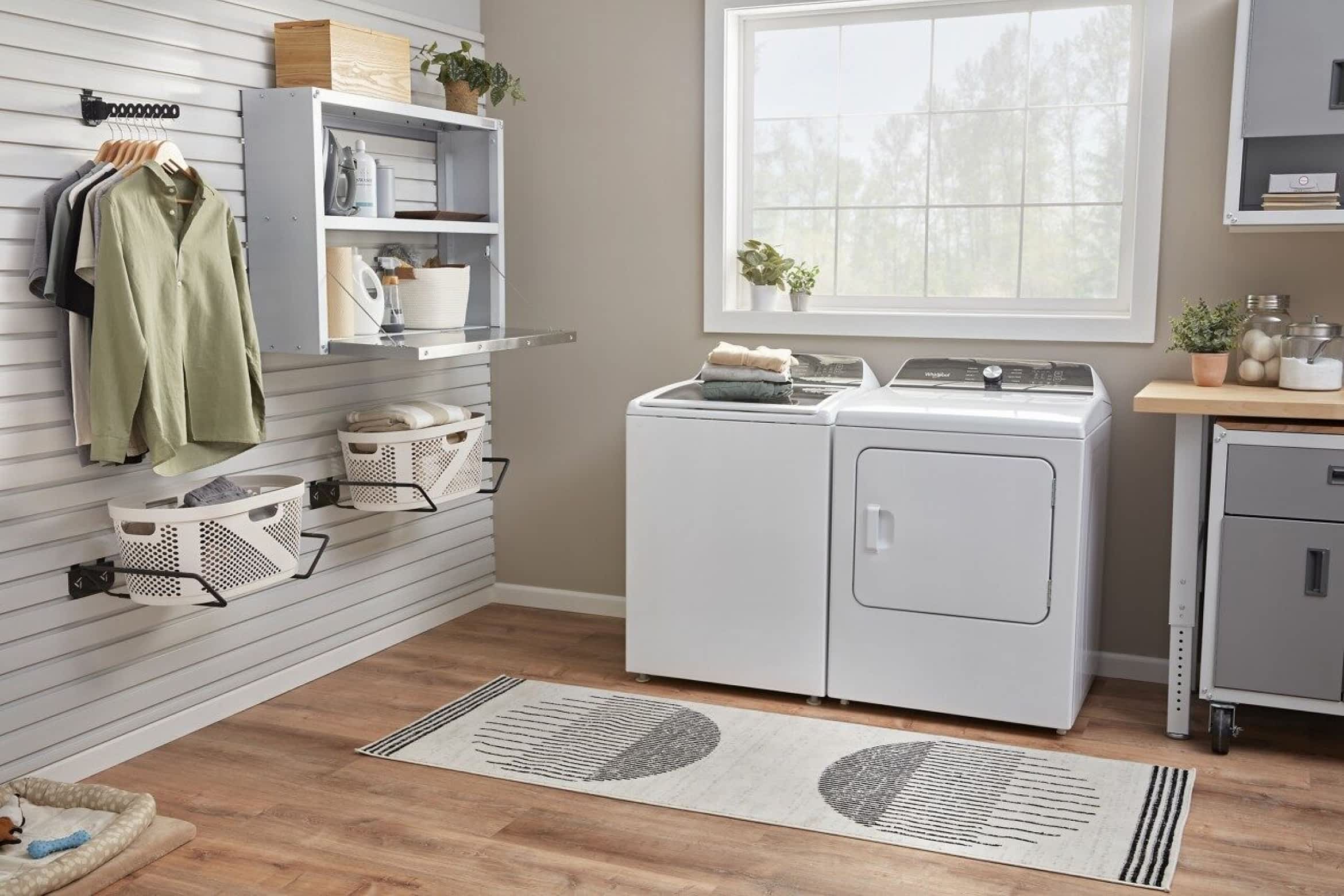 A Whirlpool® Top Load Washer & Dryer Set in a bright laundry room