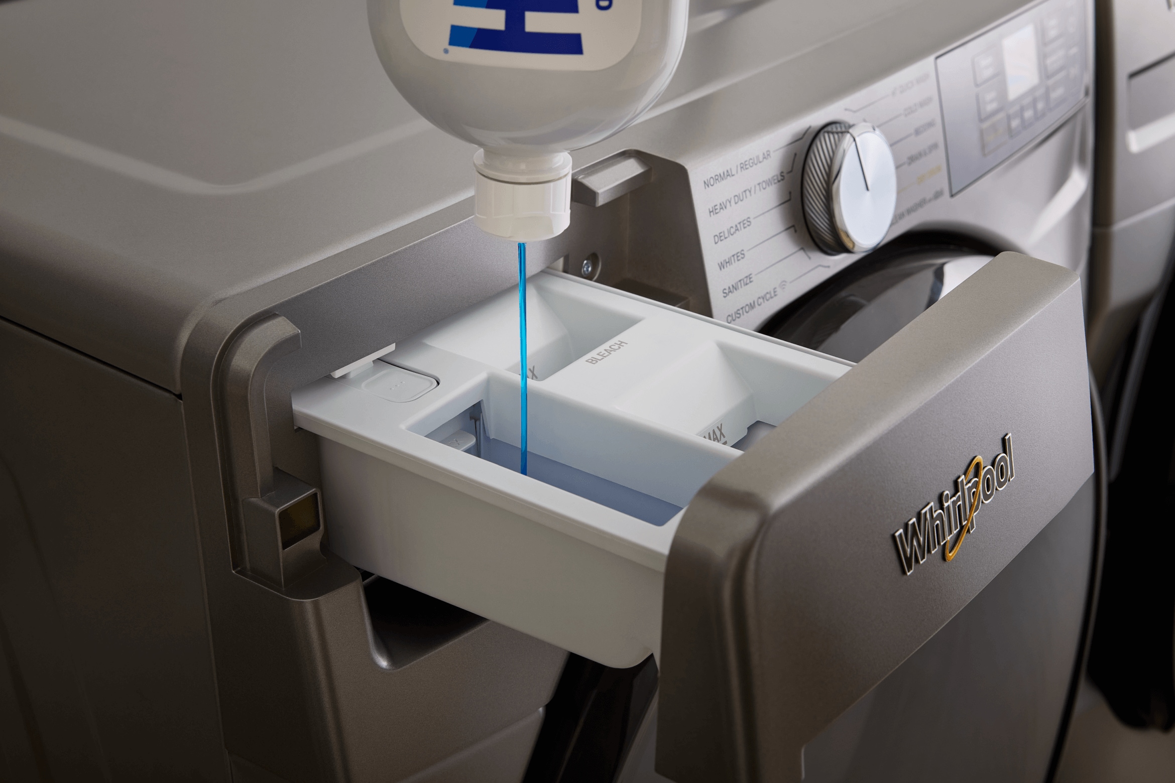 Laundry detergent is poured into a Whirlpool® Washer with a Single Load Dispenser