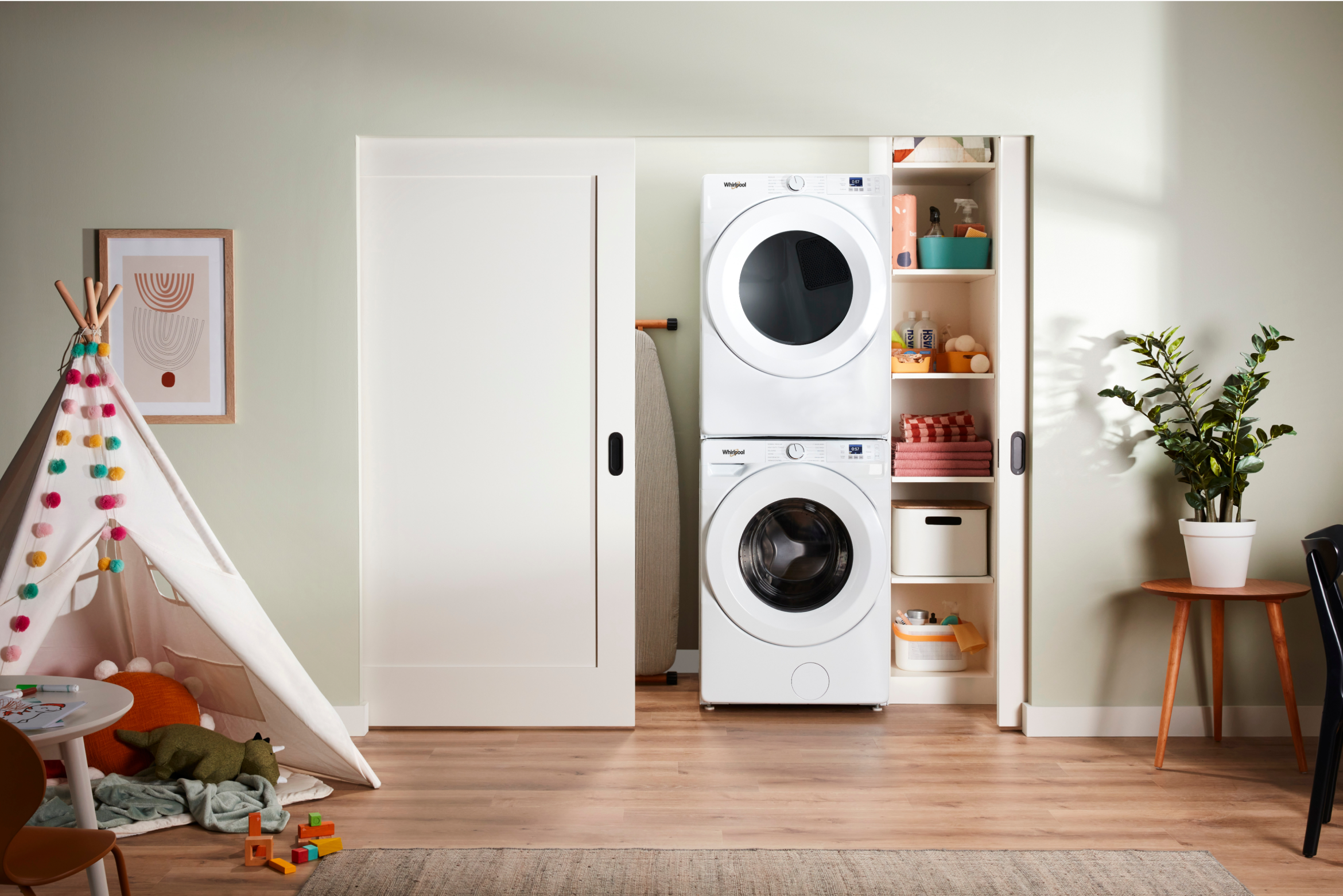 A Whirlpool® Stacked Washer & Dryer in a closet