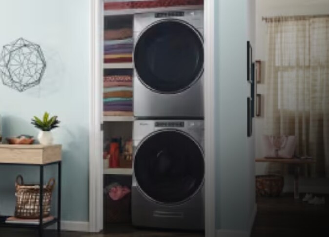 A stacked Whirlpool® washer and dryer in a closet