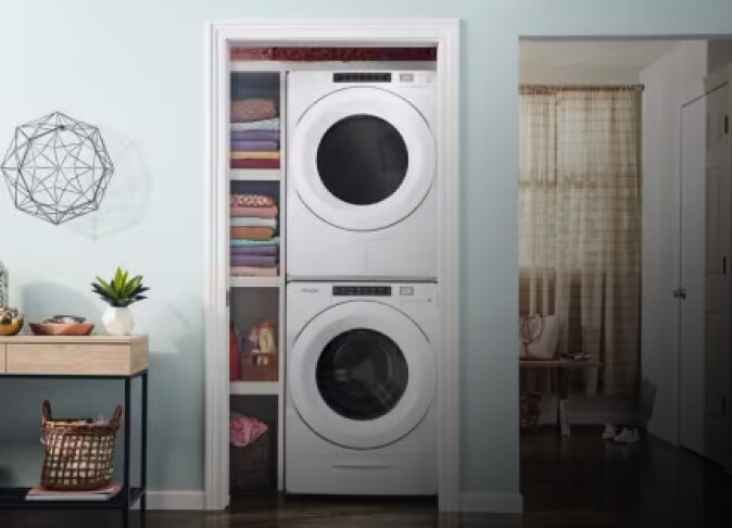 A stacked Whirlpool® washer and dryer in a closet
