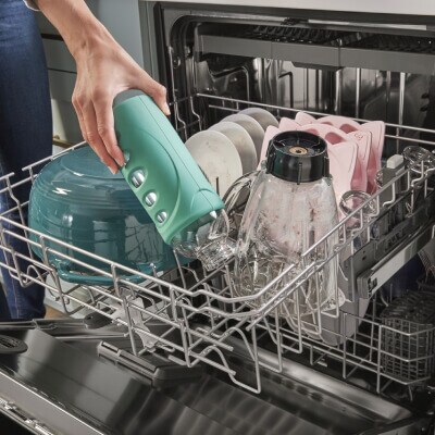 Person loading a dishwasher