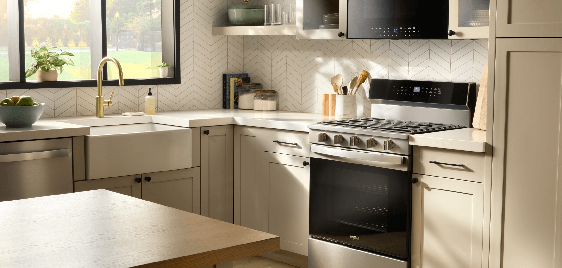 Whirlpool® Freestanding Gas Range and Flush Microwave Hood Combination in a stylish kitchen