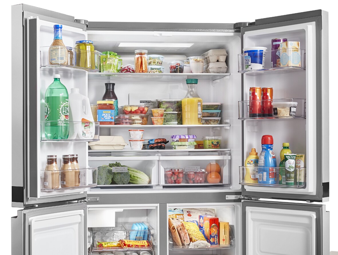 Whirlpool side-by-side refrigerator with open doors.