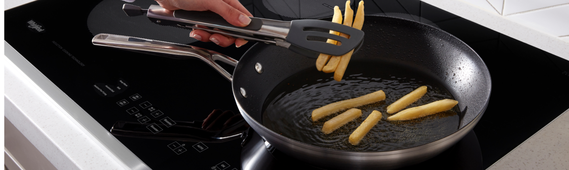French fries being cooked on a Whirlpool® Electric Cooktop