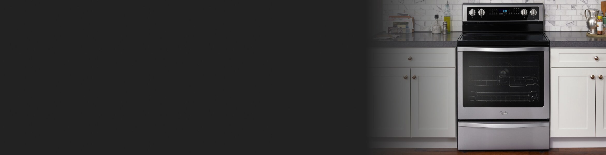 Whirlpool® Range in a kitchen with white cabinets.