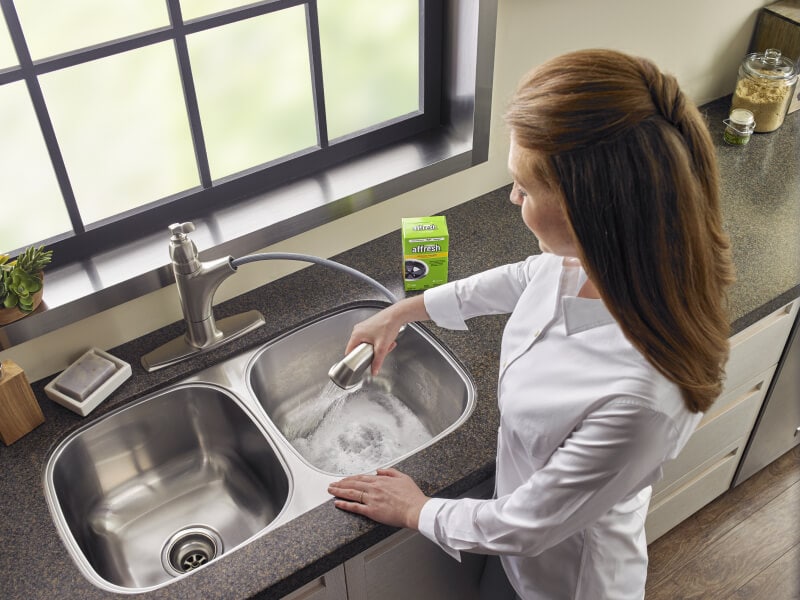 Person cleaning a sink