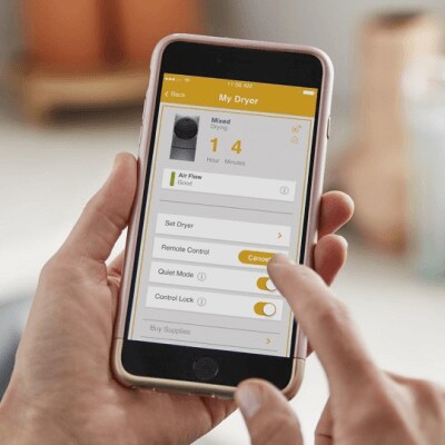 A person using the Whirlpool® app on their smartphone
