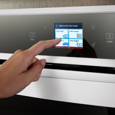 Hand making an oven selection