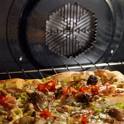 Pizza baking in an oven