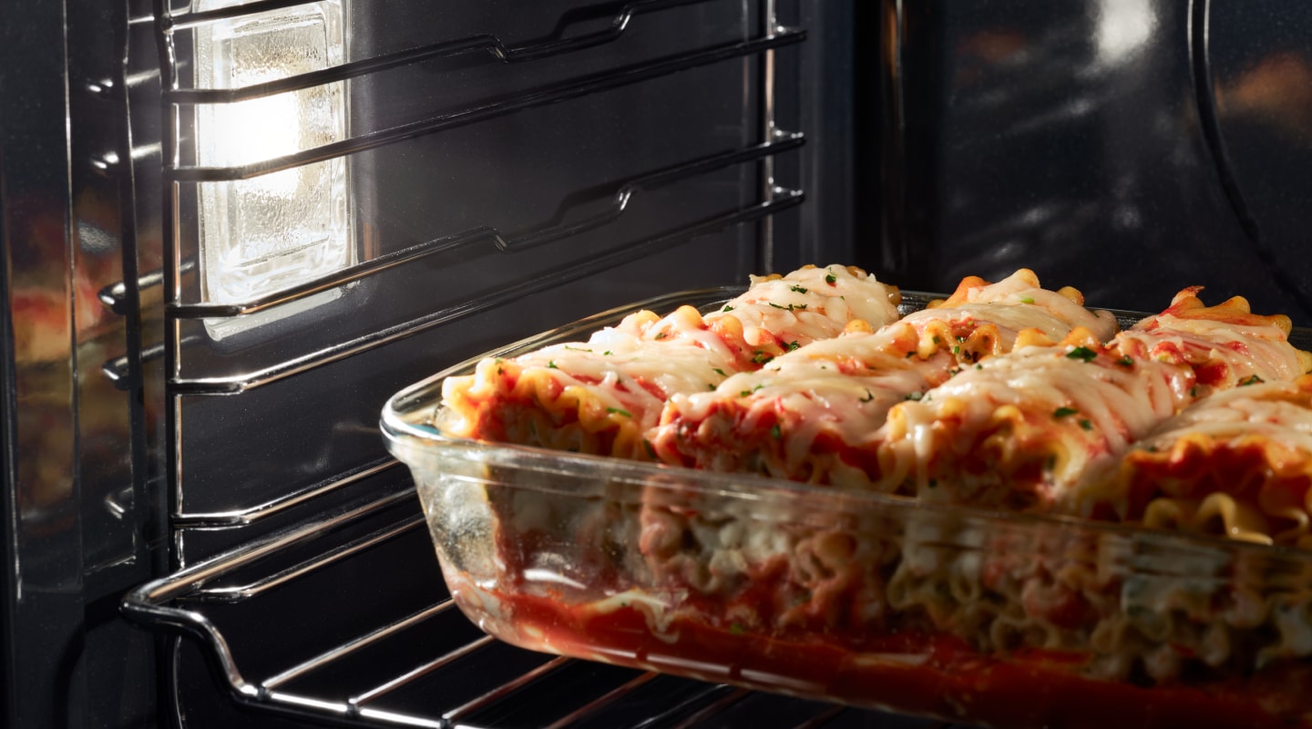 Lasagna cooking in an oven Lasagna cooking in an oven