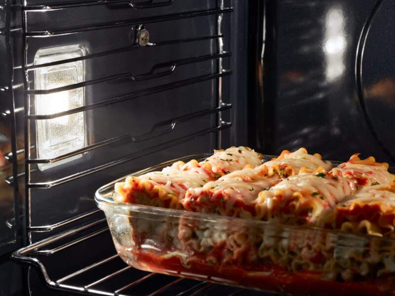 Lasagna cooking in an oven Lasagna cooking in an oven