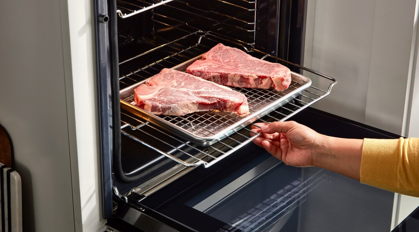 Steaks cooking in an oven Steaks cooking in an oven
