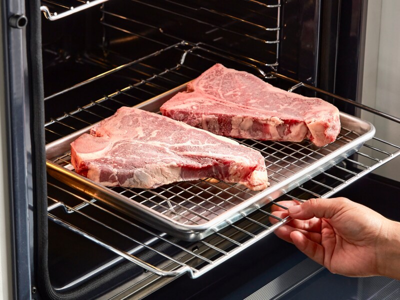 Steaks cooking in an oven Steaks cooking in an oven