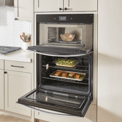 Three dishes cooking in a double oven