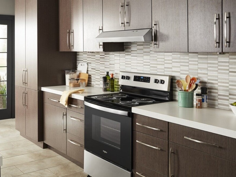 Under-cabinet range hood over a range