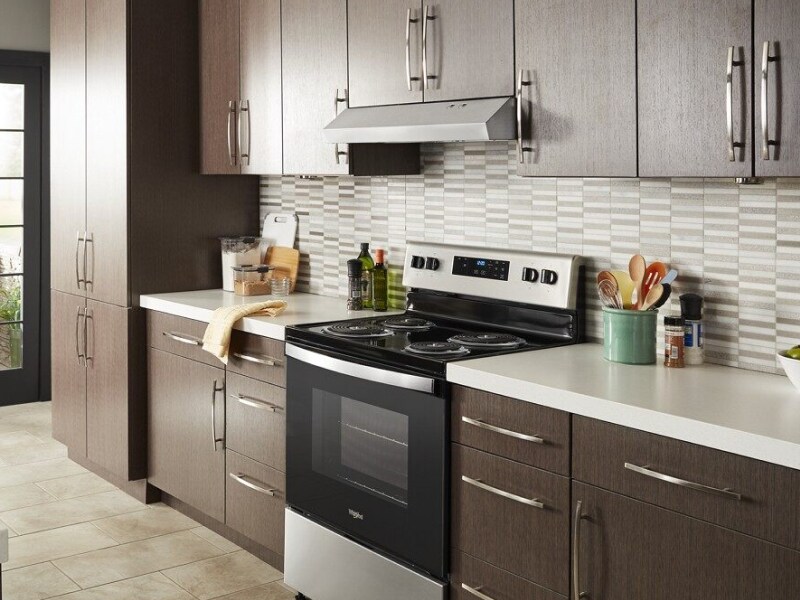 Under-cabinet range hood over a range