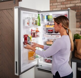 Person removing food from a refrigerator