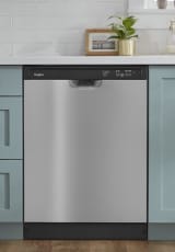 Front control dishwasher built into teal cabinets