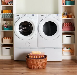 White front load washer and dryer in a modern home