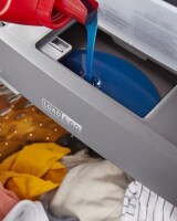 Detergent pouring into the Load & Go™ Dispenser