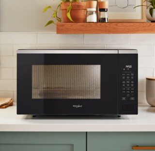 Whirlpool® Countertop Microwave on a white counter
