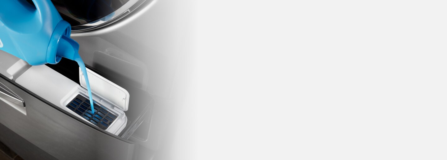 Detergent pouring into Load & Go™ XL Dispenser