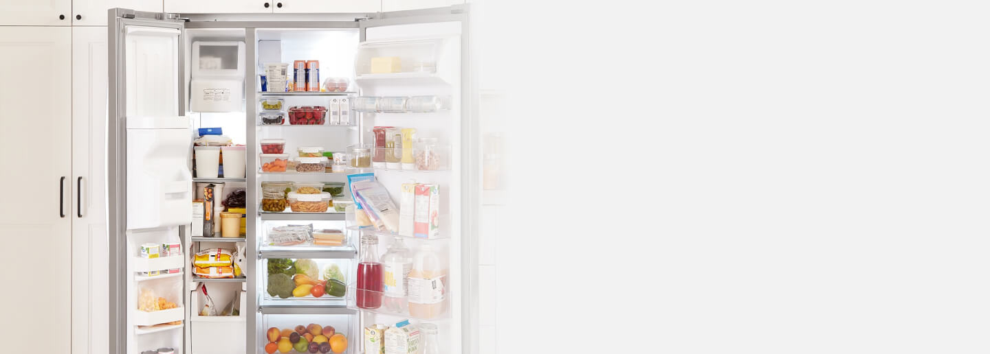 Open side-by-side refrigerator full of food