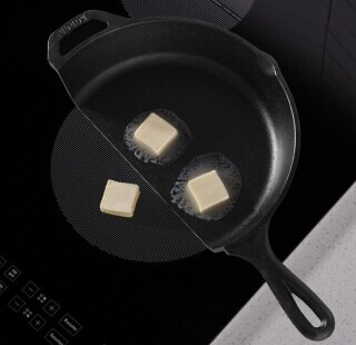 Butter melting in a cast iron pan