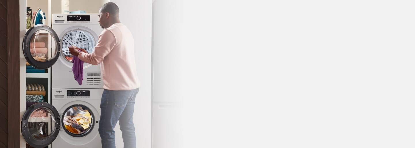 Person loading laundry into a Whirlpool® Washer