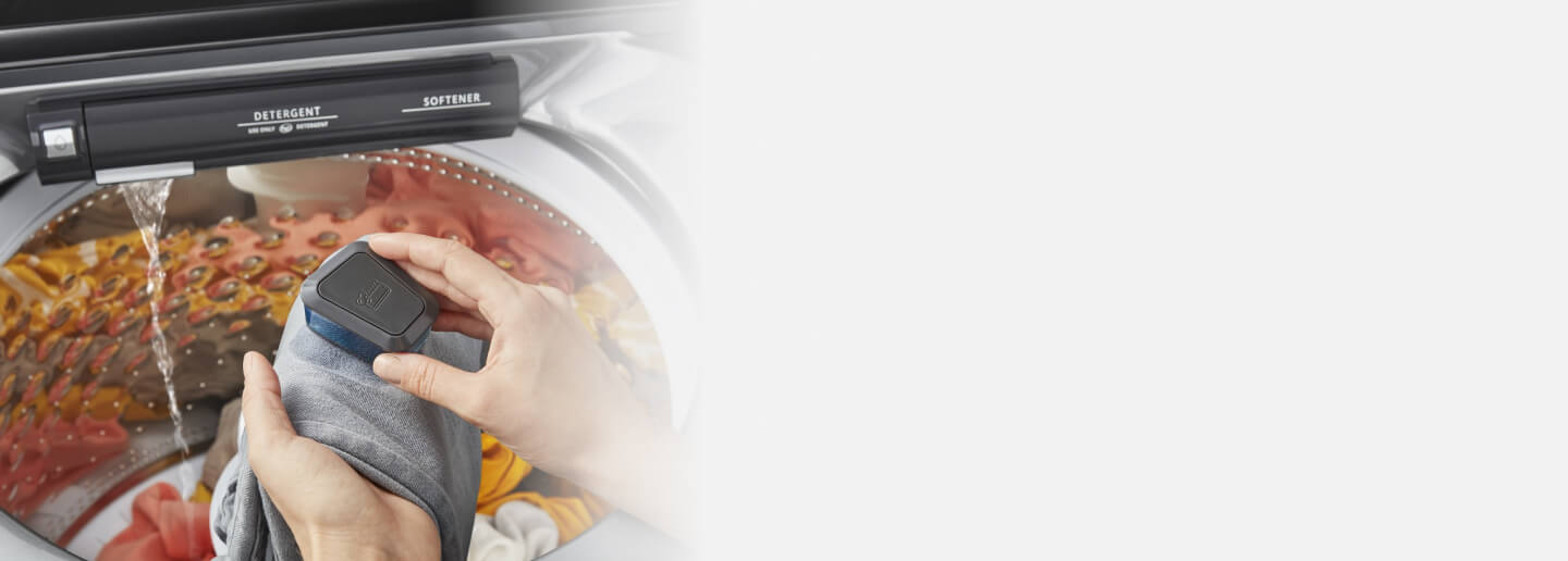 Person using the Whirlpool® Washer with Pretreat Station