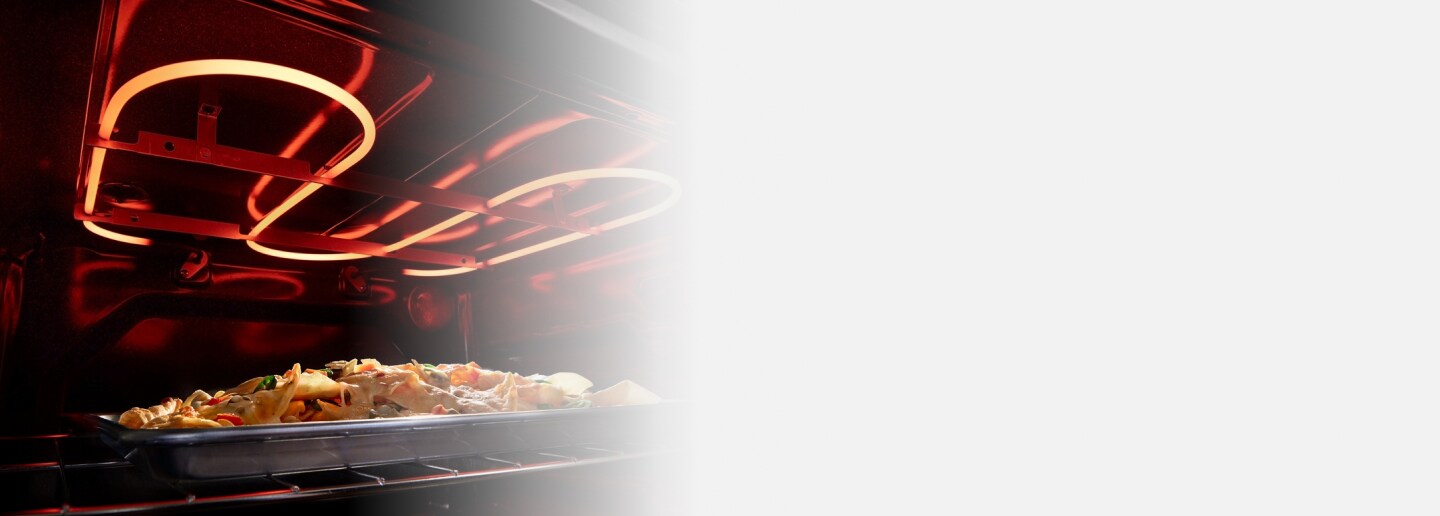 Food on a baking sheet inside an oven