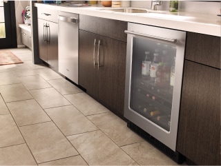 Dishwasher and undercounter refrigerator in a modern kitchen