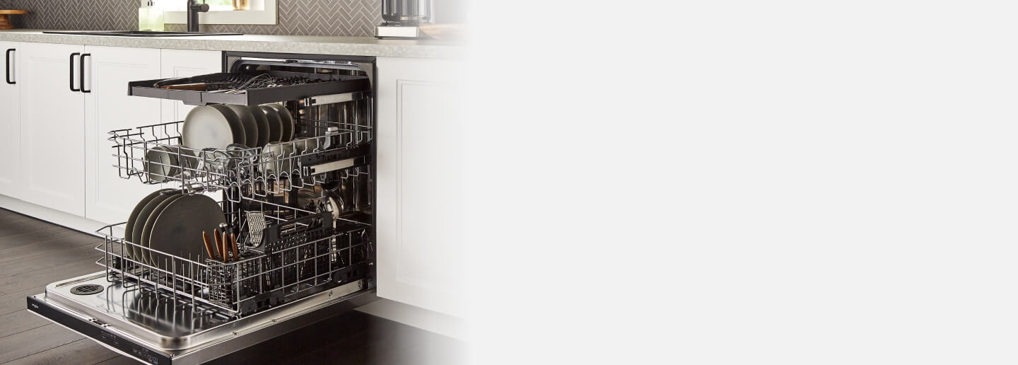 Open Whirlpool® 3rd Rack Dishwasher loaded with dishes