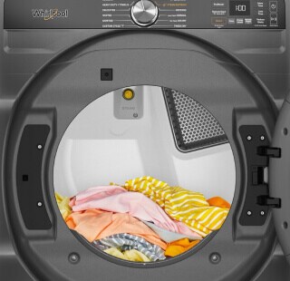 A load of colorful clothes in a dryer