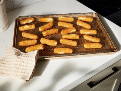 A pan with mozzarella sticks on it